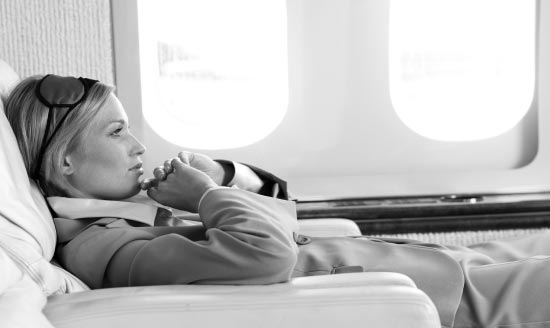 Woman reclining on plane